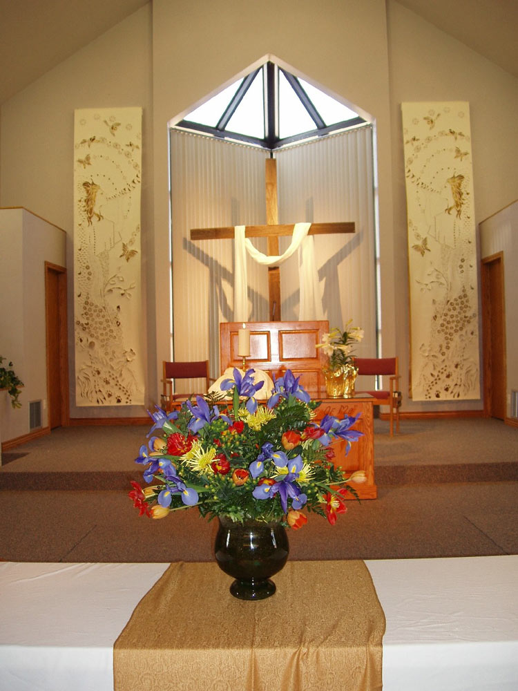 Flowers in front of the cross